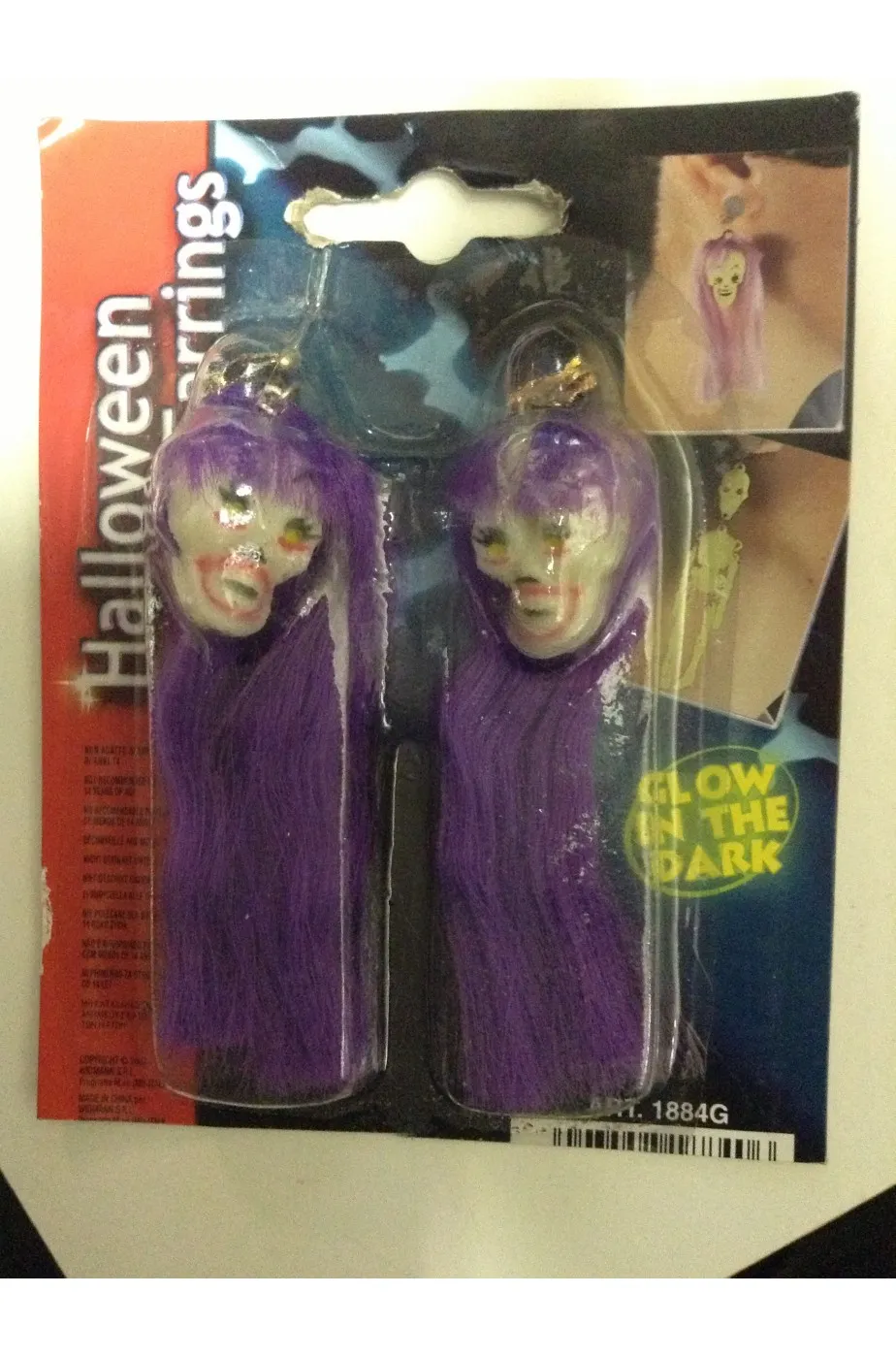 Orecchini Halloween horror con teschi fosforescenti viola con clip